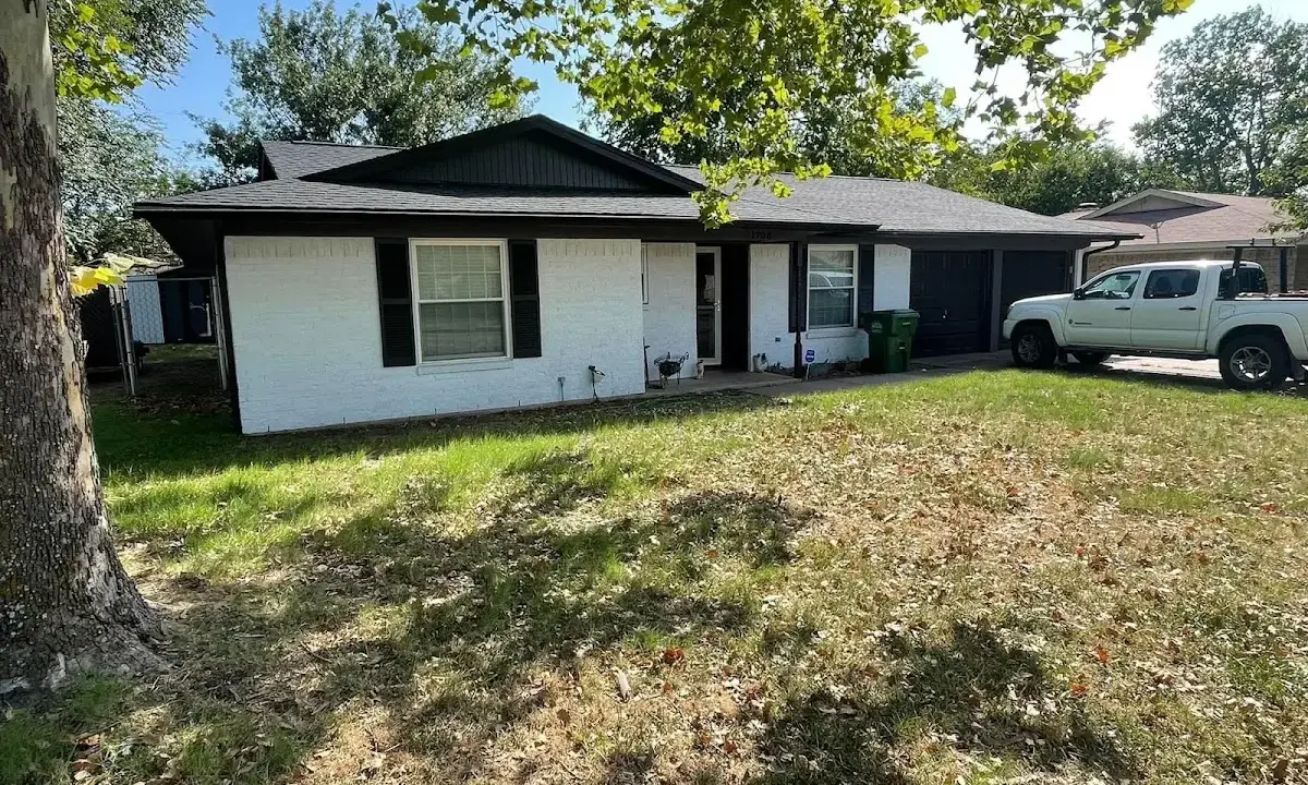 Professional roofing crew working on a residential roof in Sun City West